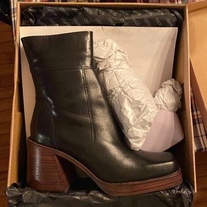 Black leather woman’s ankle boots.